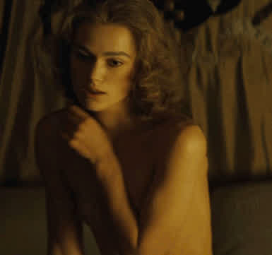 Keira Knightley covering her nearly nonexistent tits