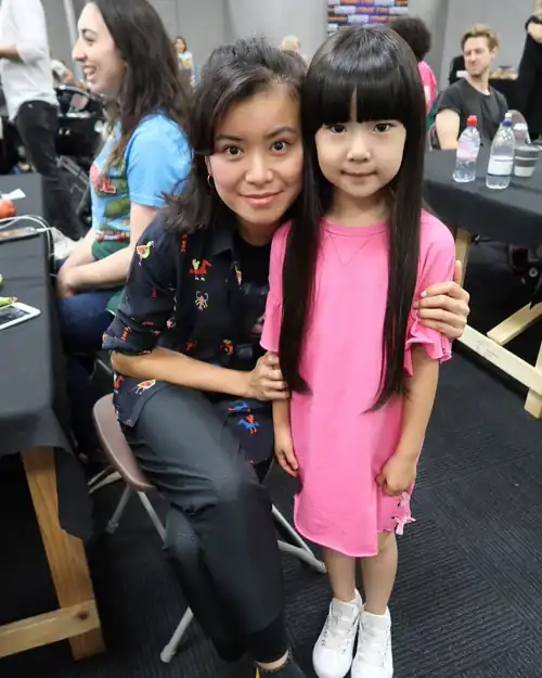 Posing with a young fan (child actress Ivy Wong)