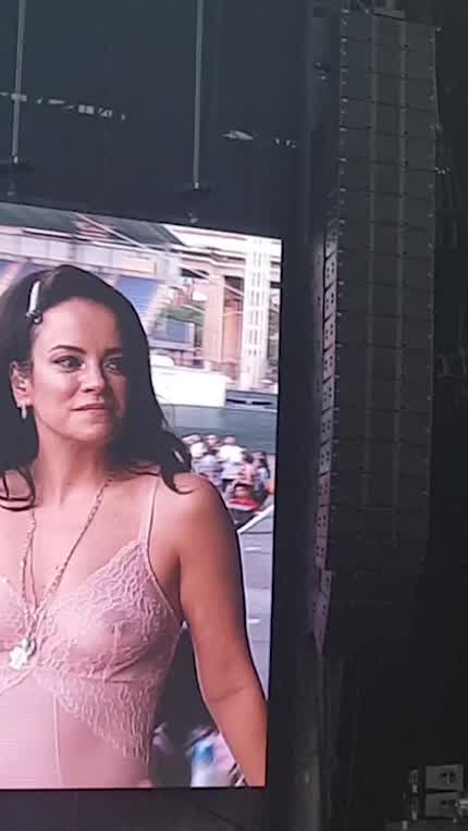 Lily Allen performs in a see-through top