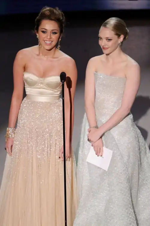 Miley Cyrus and Amanda Seyfried appear during the 82nd Academy Awards Sunday, March 7, 2010