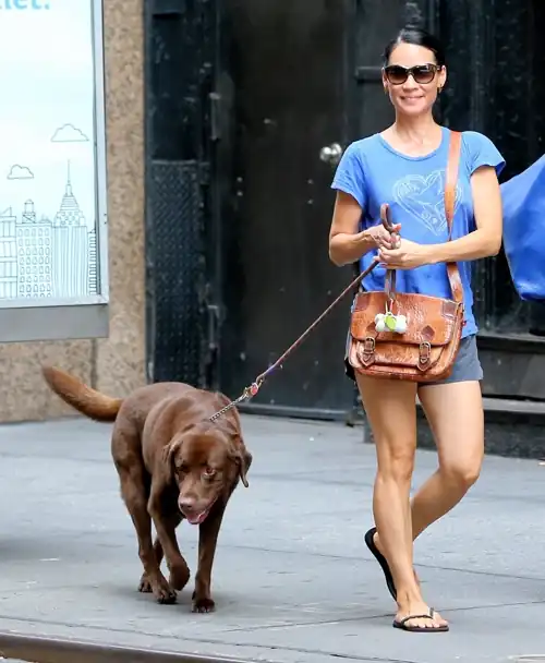 Lucy walking her dog