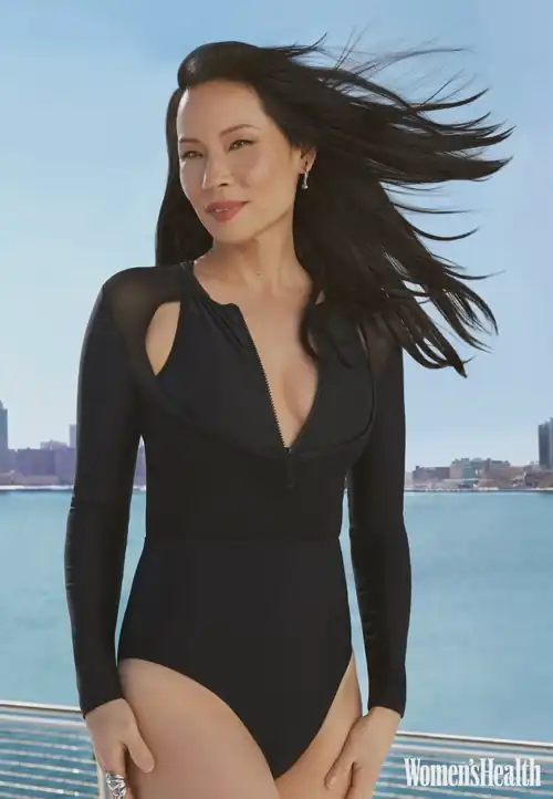 Lucy Liu rocking a one piece Swimsuit like the Queen that she is