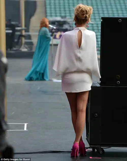 From behind