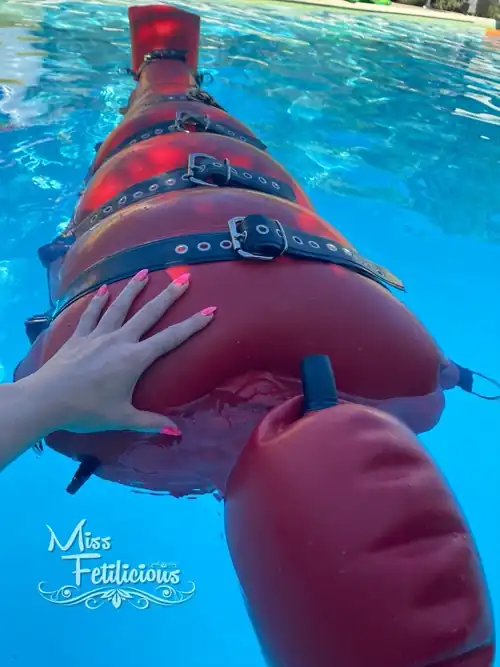Floating in heavy rubber bondage sack