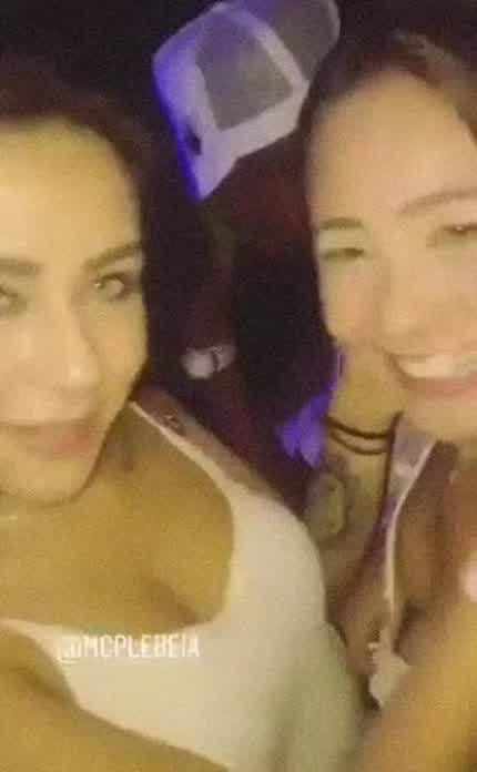 Friends kissing at a party