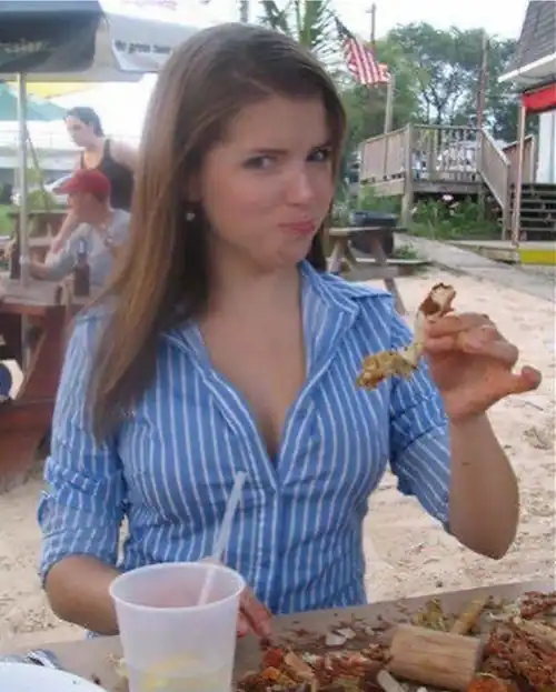What a cute dork. That shirt needs to be unbuttoned two more times. Wonder what coloured bra she has under there.