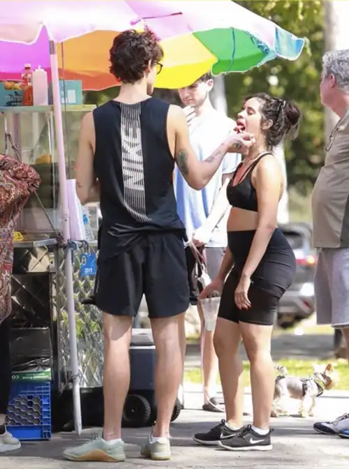 Shawn feeding Camila with her burgeoning belly