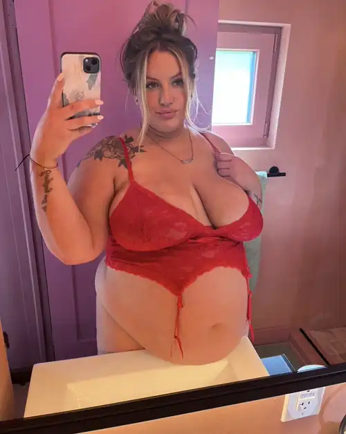 Resting my belly on the sink because it’s so heavy 