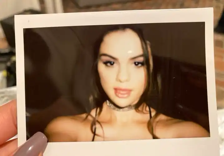 Taking a photo of herself - IG July 2024