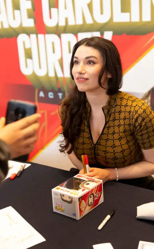 To apologise for the trainwreck of the latest Shazam movie , the producers should just offer disgruntled fans a chance to grope Grace Caroline Currey's massive jugs to release all their frustrations . 