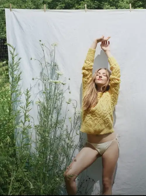 Amanda in a sweater and string bikini bottoms