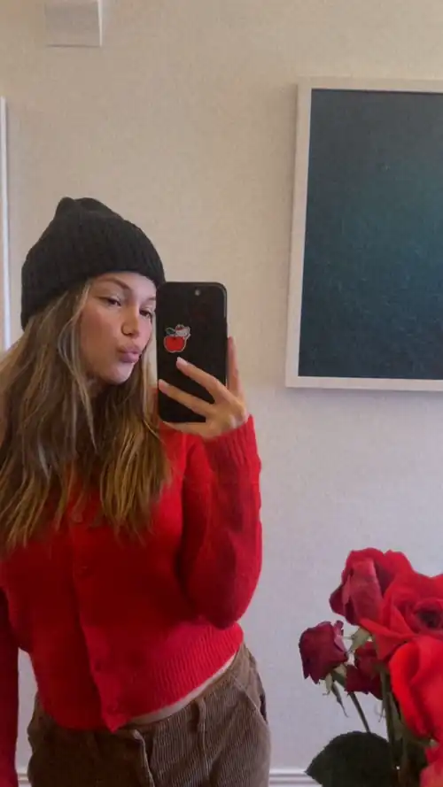 Mirror selfie in a beanie and sweater 7/18/2024