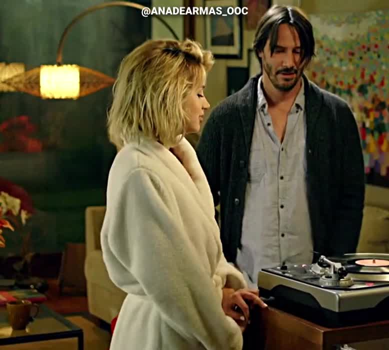 Ana de Armas dancing in a bathrobe
