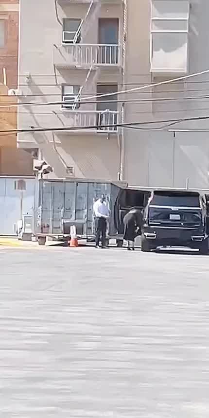 Selena seen heading to the rear entrance of a studio.