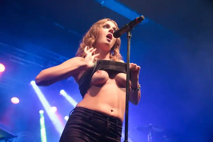 Tove Lo bares her breasts during a concert