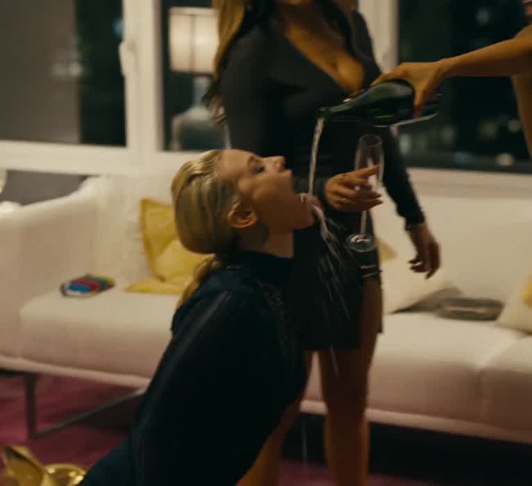 Lili Reinhart on her knees with her tongue out in Hustlers (2019)