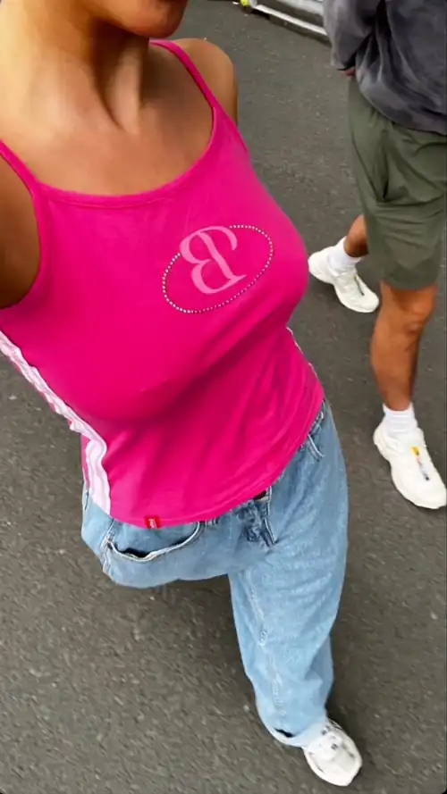 Millie is clearly drawing attention to her boobs