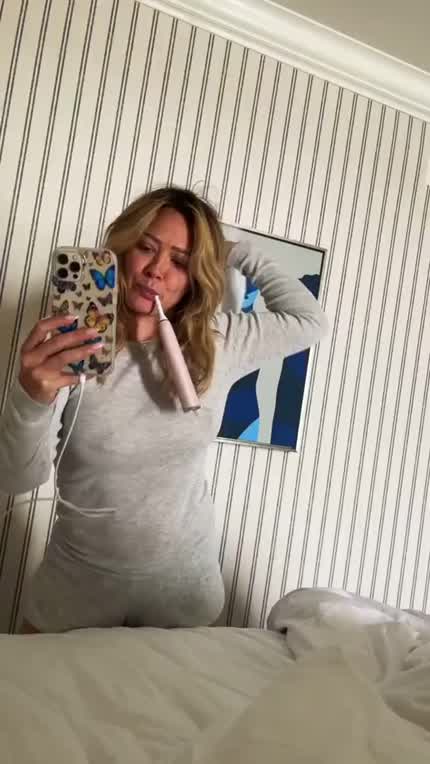 Hilary Throwing a Pillow