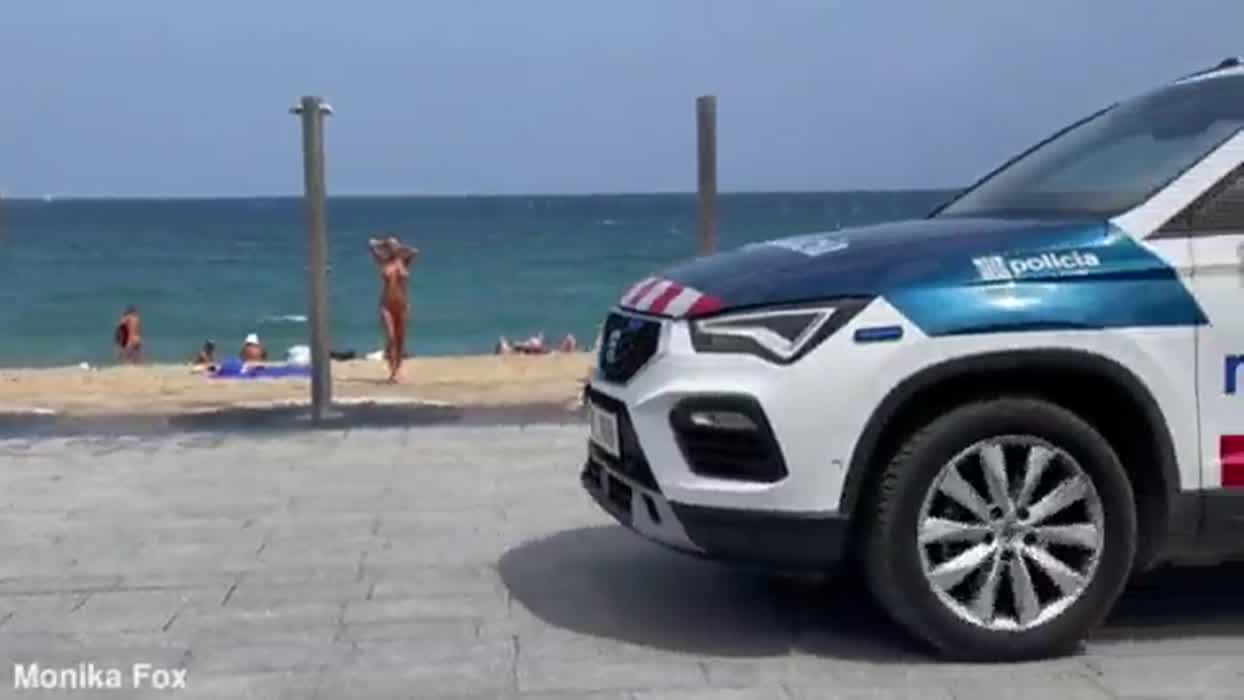 Showering nude at the beach in Barcelona