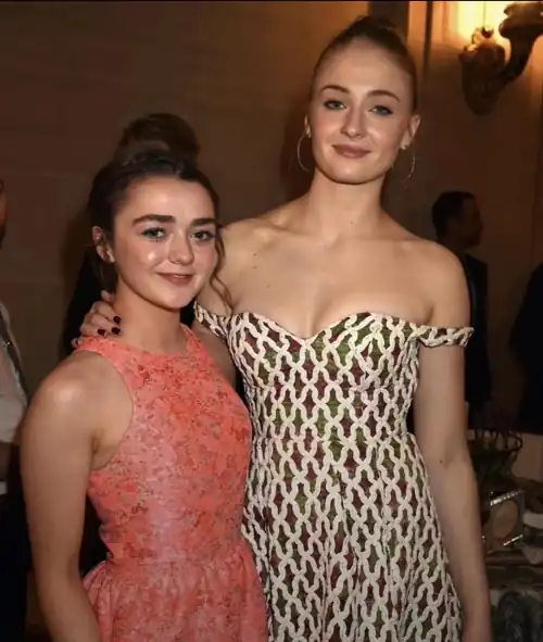 I want Sophie Turner to fuck Maisie Williams' face with my cock, pushing her head down and making her gag and slobber all over it then stroking me off all over Maisie's ruined face