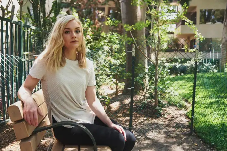 Emily sitting outside, enjoying the outdoors