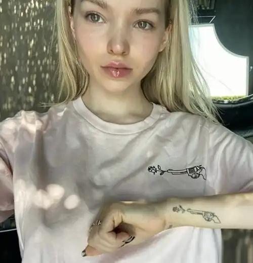 Dove got that tattoo to honor her co star Cameron Boyce who passed away. It’s called wielding peace.