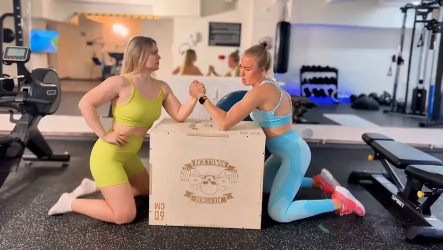 The battle of the biceps: who will emerge victorious in this intense arm wrestling match?
