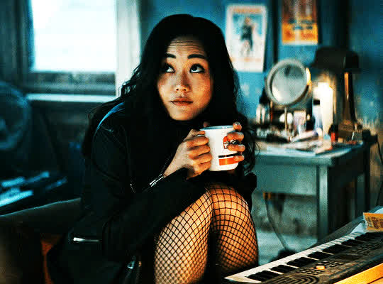 Karen Smiling while holding a Mug