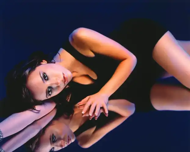 In a black dress in Maxim Magazine (1999)