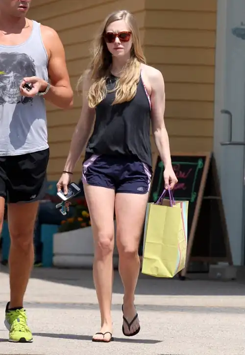 Shopping in a tank top, running shorts and flip-flops