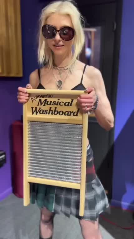 Showing off her washboard abs - March 2024