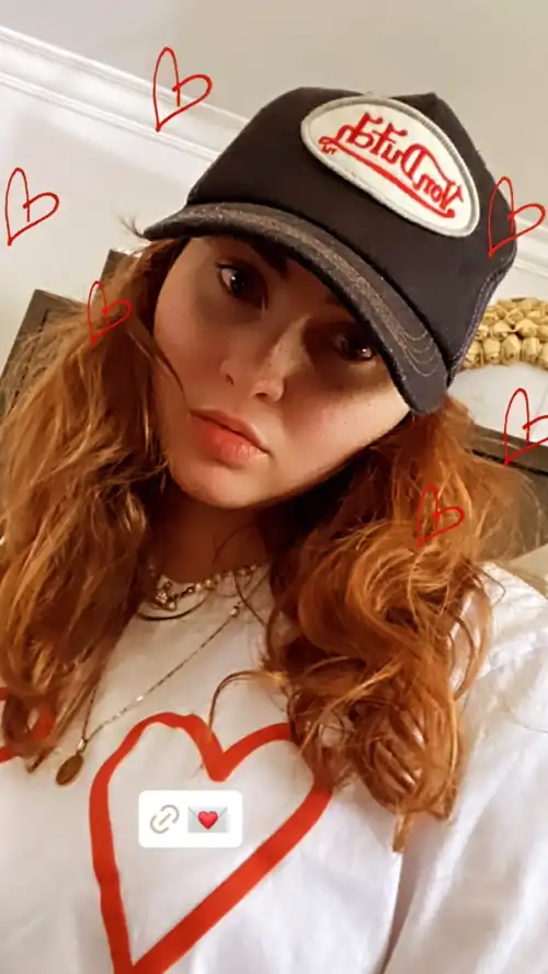 Sarah wearing merch