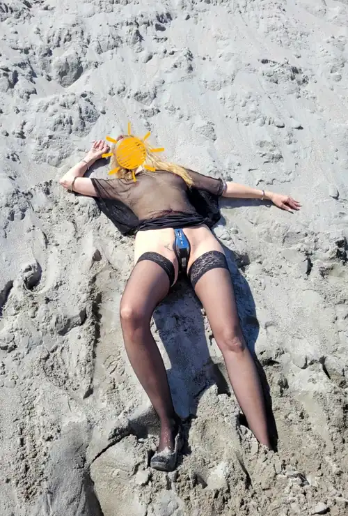 With chastity belt in the sand
