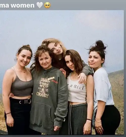 With her sister and mom