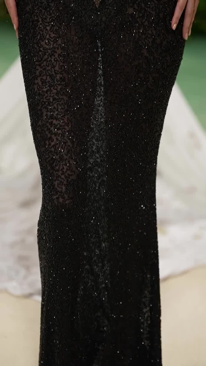 At the Metgala wearing a Givenchy Haute Couture Fall Winter 1999 dress in tulle embroidered with black and brass beads and sequins designed by Alexander McQueen - May 2024