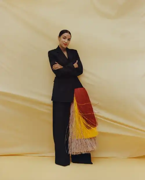 Alexandria Ocasio-Cortez, the feathers are part of the traditional garb of Puerto Rico, where her family is from (2020)