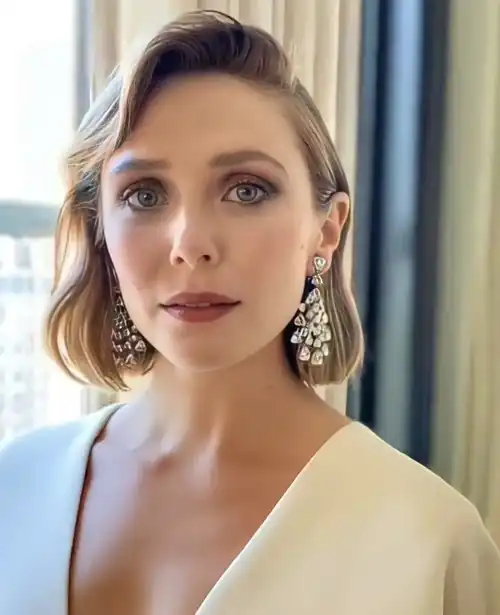 Behind closed doors, classy beauty Elizabeth Olsen is a complete cock whore. She definitely loves every second of being fucked in all of her holes.