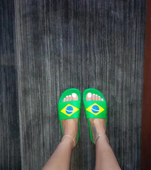 Rihanna's beautiful feet and Brazilian flag slippers. Nothing beats Rihanna's white polished nails