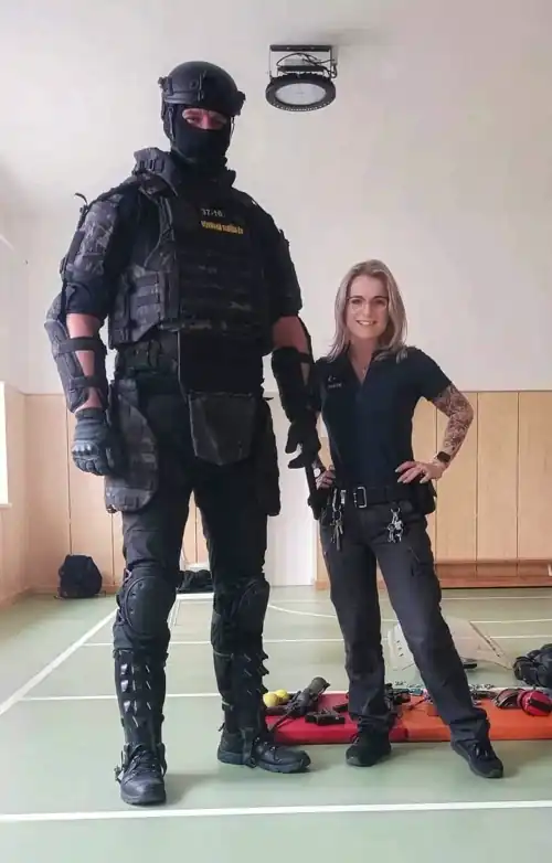 Czech Prisoner Transport Officer Jakub and Prison Guard Eliska during police presentation in local Czech school today. [896x1401] 