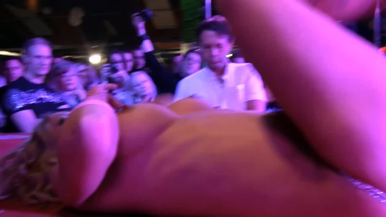 Sexy Blonde Stripping on Public Stage on a Sex Fair
