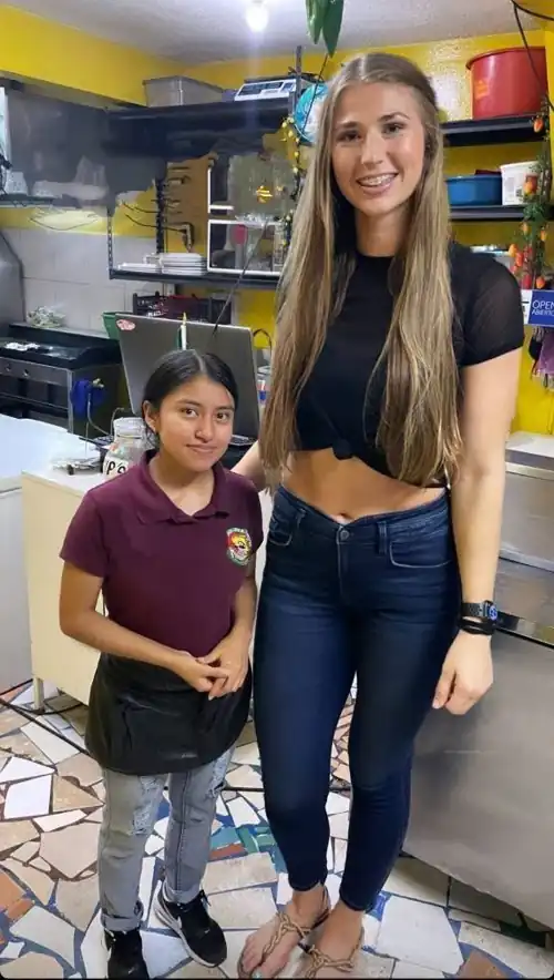 She looks so little next to her