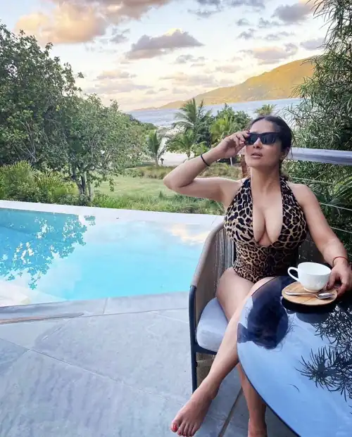 Salma having some coffee by the pool via IG (January 2022)